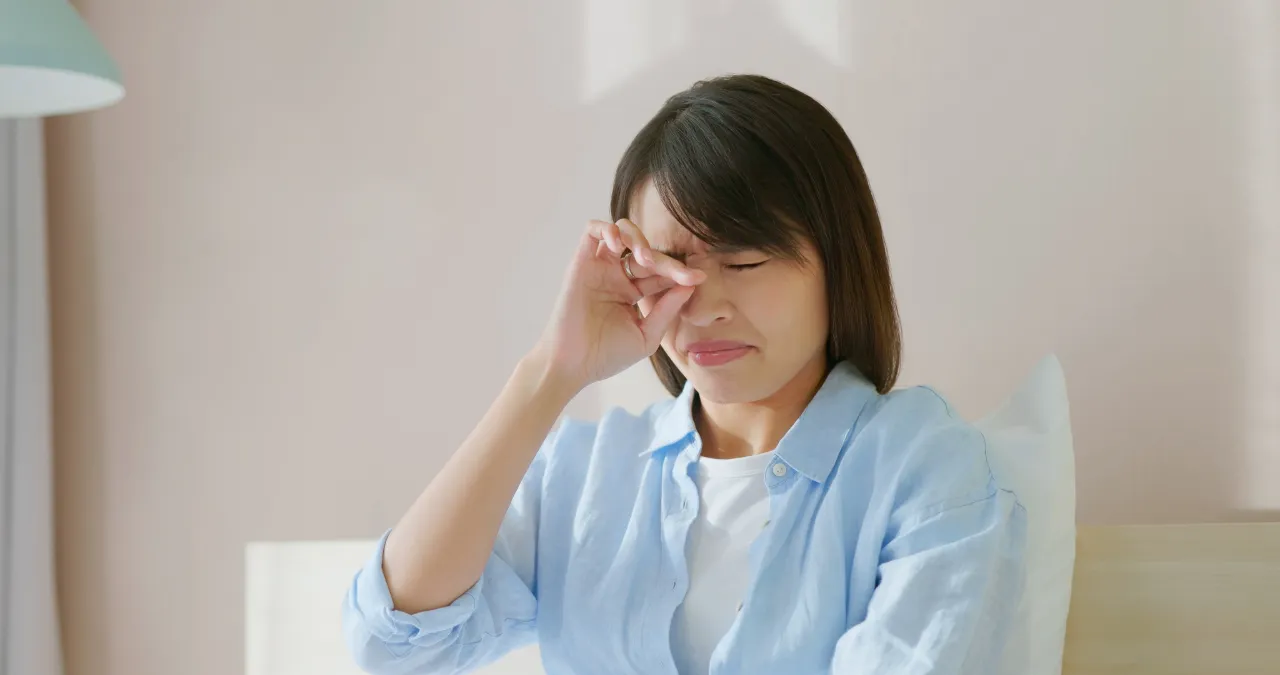 Woman rubbing her eyes due to discomfort